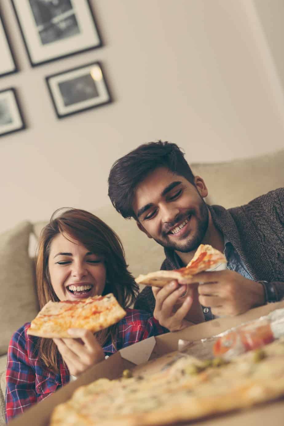 Couple eating pizza